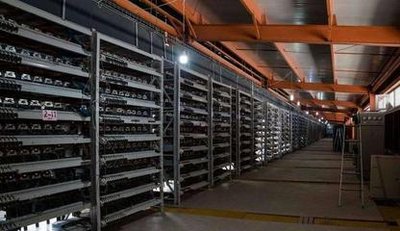 An expansive cryptocurrency mining farm bustling with activity